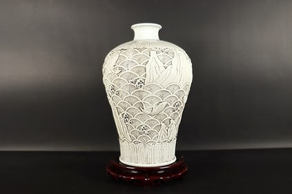 Chinese white carved vase. H: 11.5" x W: 7."