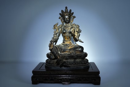 Chinese bronze buddha. H: 10.5" x W: 7.5."