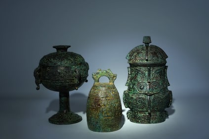 Lots Chinese bronze vessels. Largest H: 7" x W: 6."