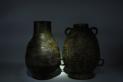 Lots Chinese bronze vessels. Largest H: 13" x W: 10."