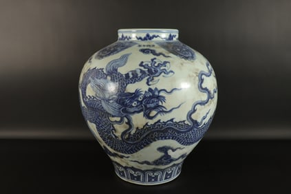 Chinese fine blue and white dragon jar. H: 13" x W: 12.5."