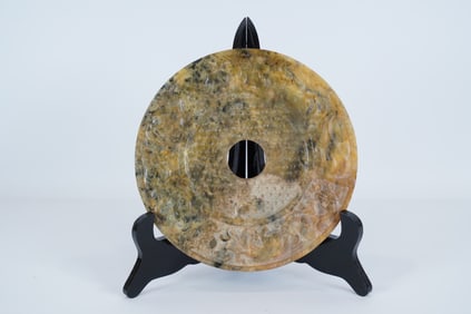 Chinese large carved disc. H: 0.25" x W: 7.5."