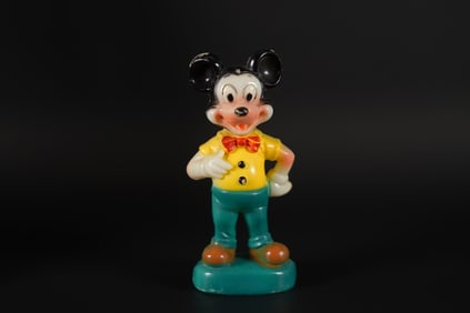 An antique Mickey Mouse figure