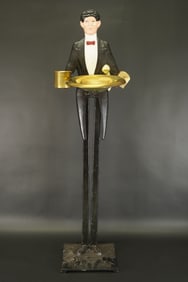 A vintage serving tray figure