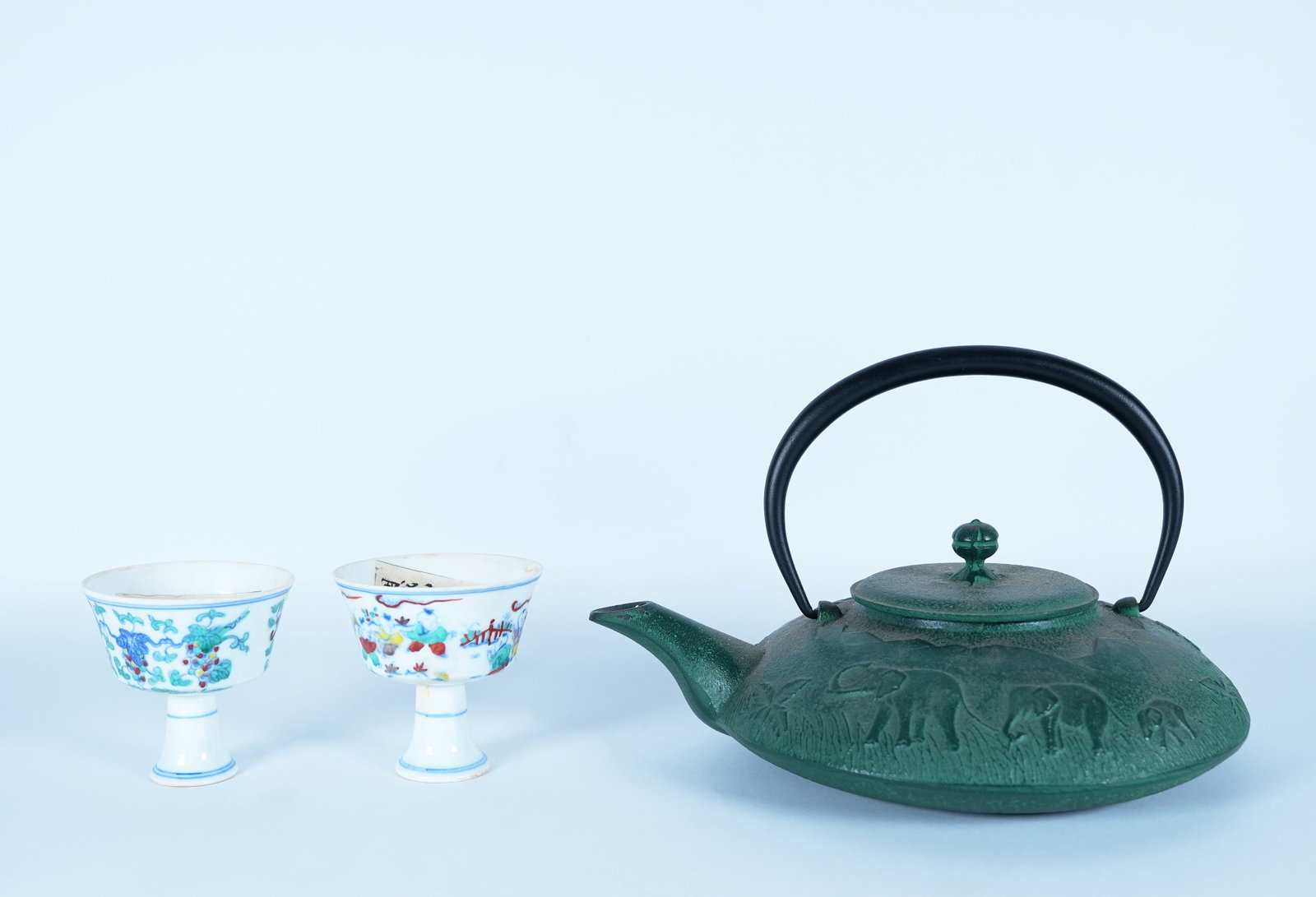 Lots Asian items: Lots Asian items, cast iron teapot with cups. Largest H: 4" x W: 7."