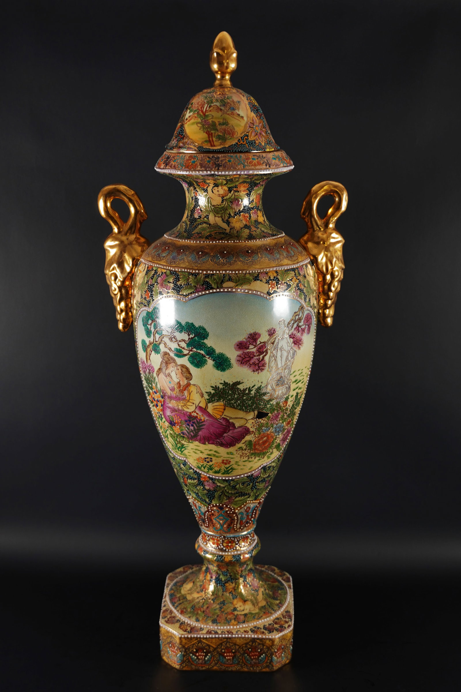 A vintage tall urn: A vintage tall urn. H: 27.25" x W: 13."