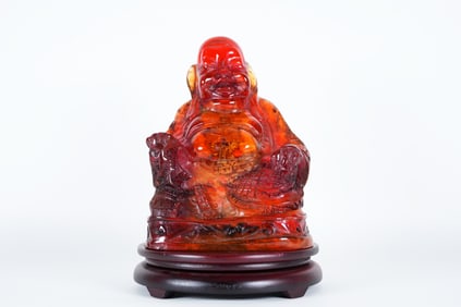 A vintage Chinese amber buddha