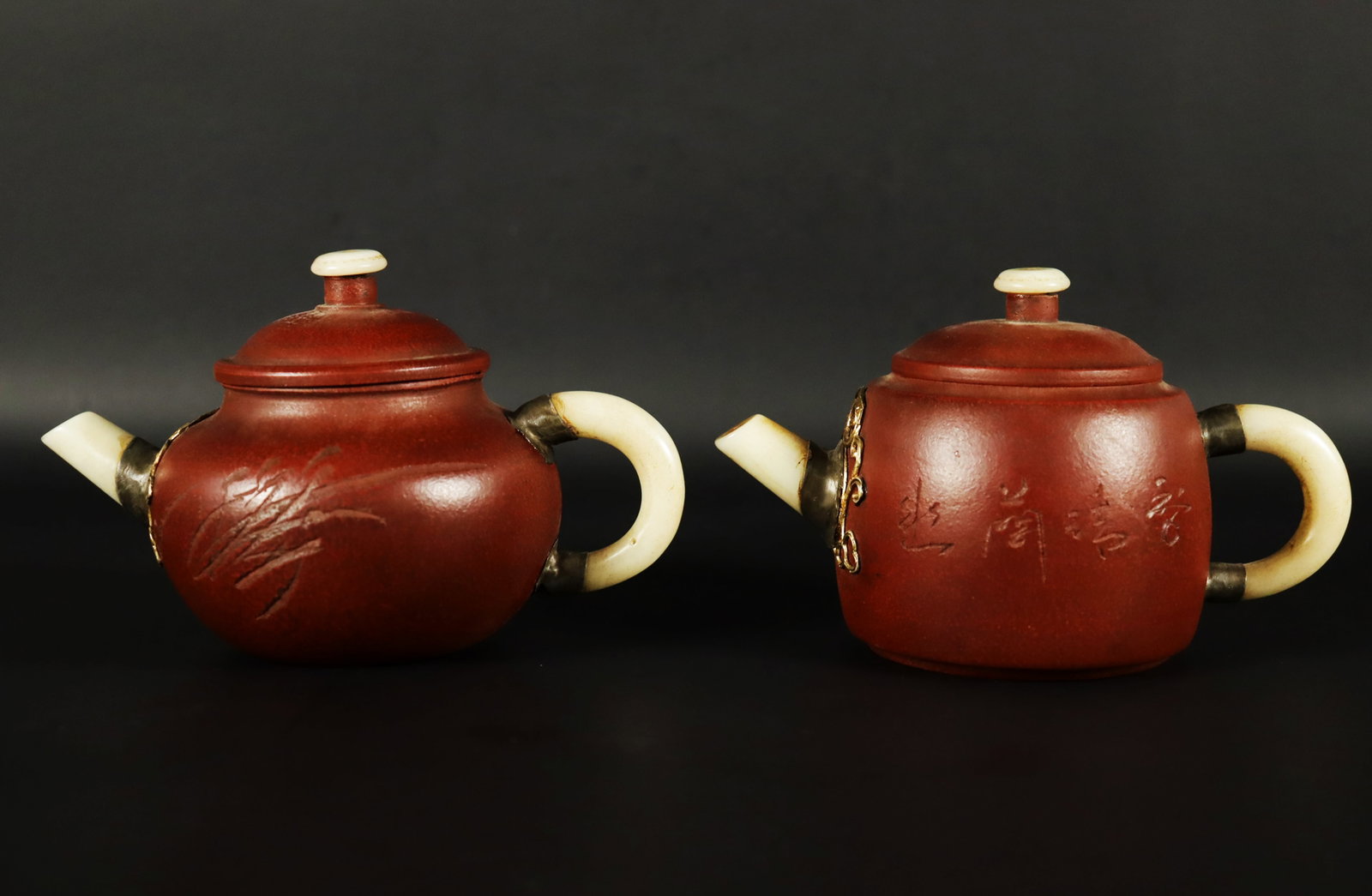 2 Chinese clay teapots: 2 Chinese fine clay teapots. Largest H: 2.9" x W: 6.6."