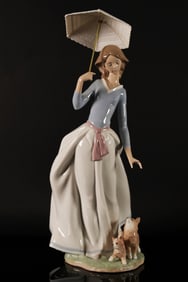 A Lladro umbrella woman