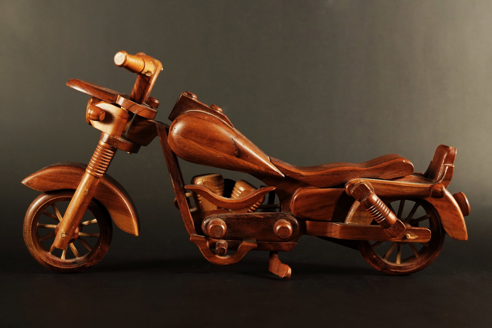 A wooden craft motorcycle: A wooden craft motorcycle. H: 8" x W: 15."