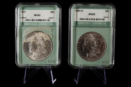 2 antique Morgan dollar graded