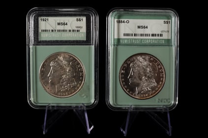 2 antique Morgan dollar graded