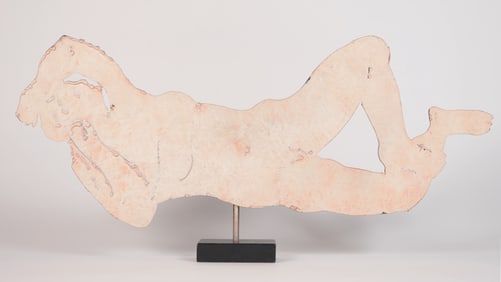 A carved figure with stand
