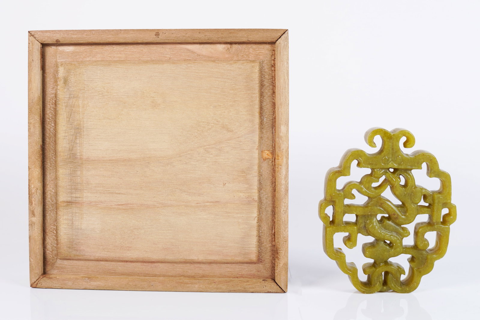 Chinese fine carving with box: Chinese fine carved ornament in wooden box. H: 4.2" x W: 3.5."