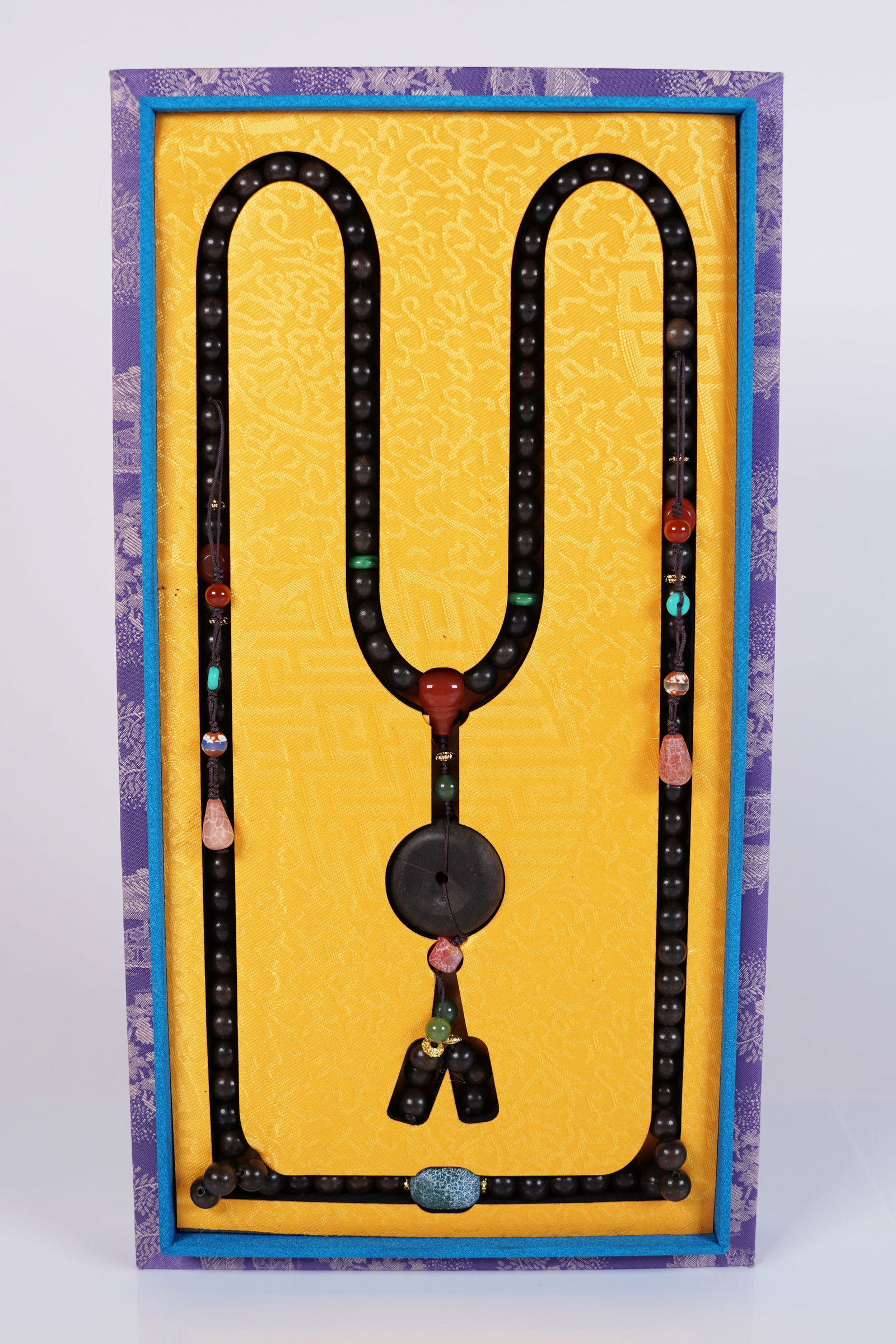 Chinese wooden bead in box: Chinese wooden bead in silk box.