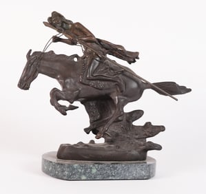 A Remington style bronze statue