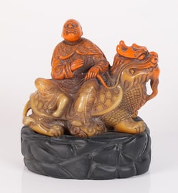 Chinese carved deity on stand