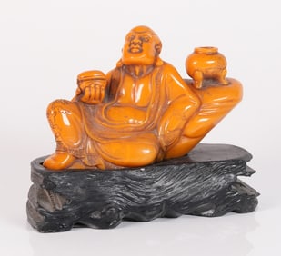 Chinese carved deity on stand