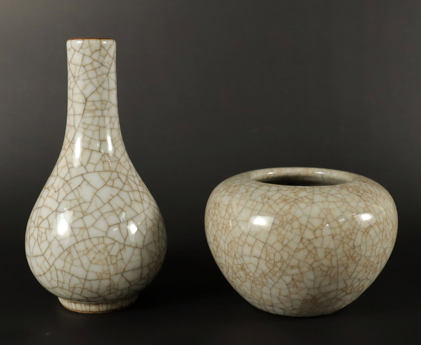 2 Chinese crackled porcelains: 2 Chinese fine crackled porcelains, largest H: 7" x W: 3.5."