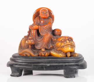 Chinese carved deity on stand