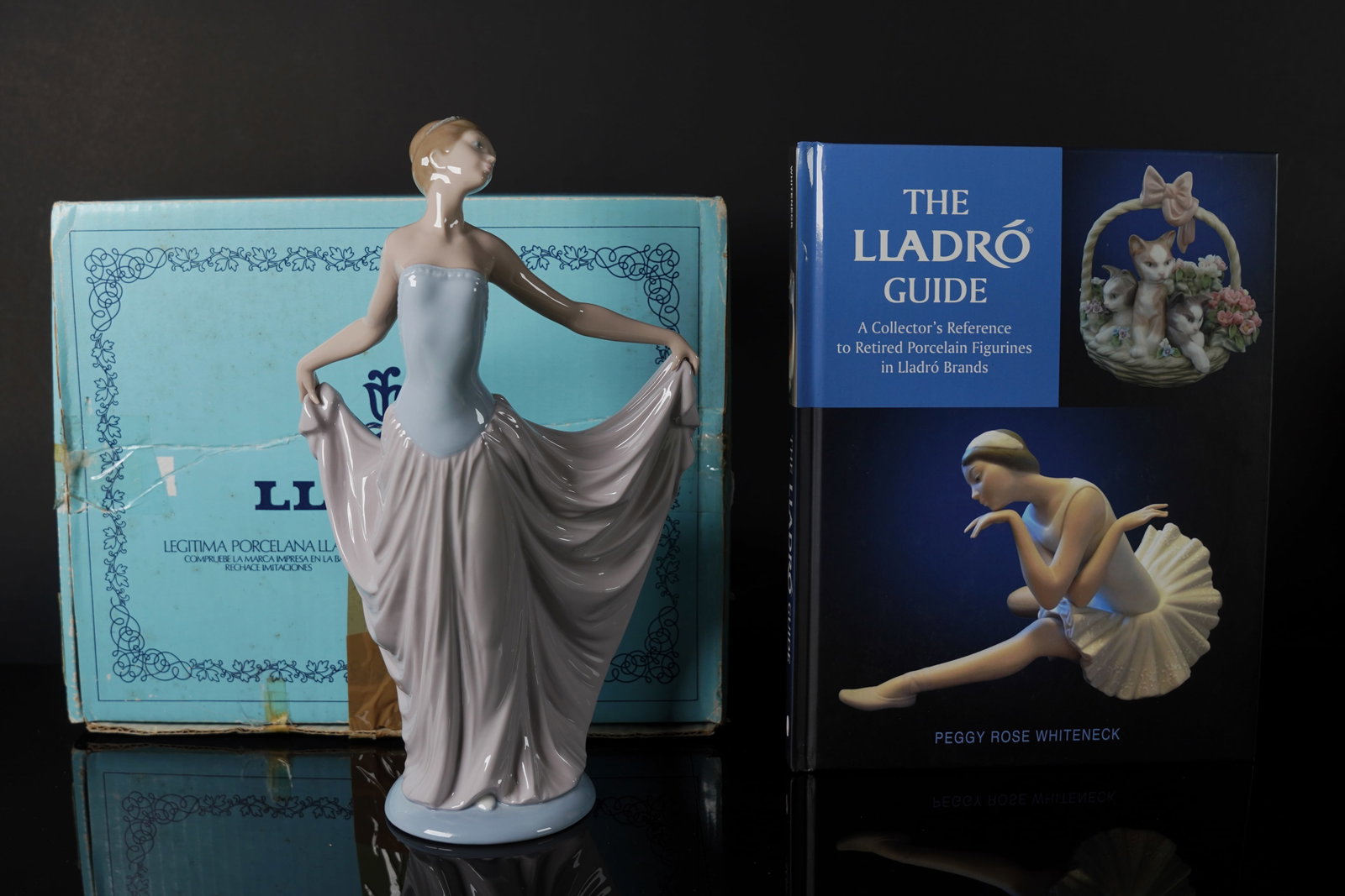 A tall Lladro figurine with box: A tall Lladro figurine with original box. H: 12" x W: 7."