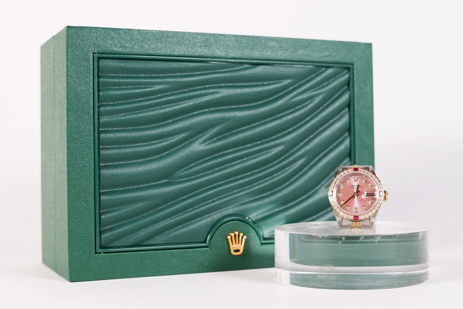 Rolex style lady Datejust possible 14kt gold diamond watch ungraded: Rolex lady Datejust possible 14kt pink dial diamond watch with ruby. From an estate, condition selling it as is. All sales are final. Did not guarantee, possibly Rolex style. Ungraded or authenticated