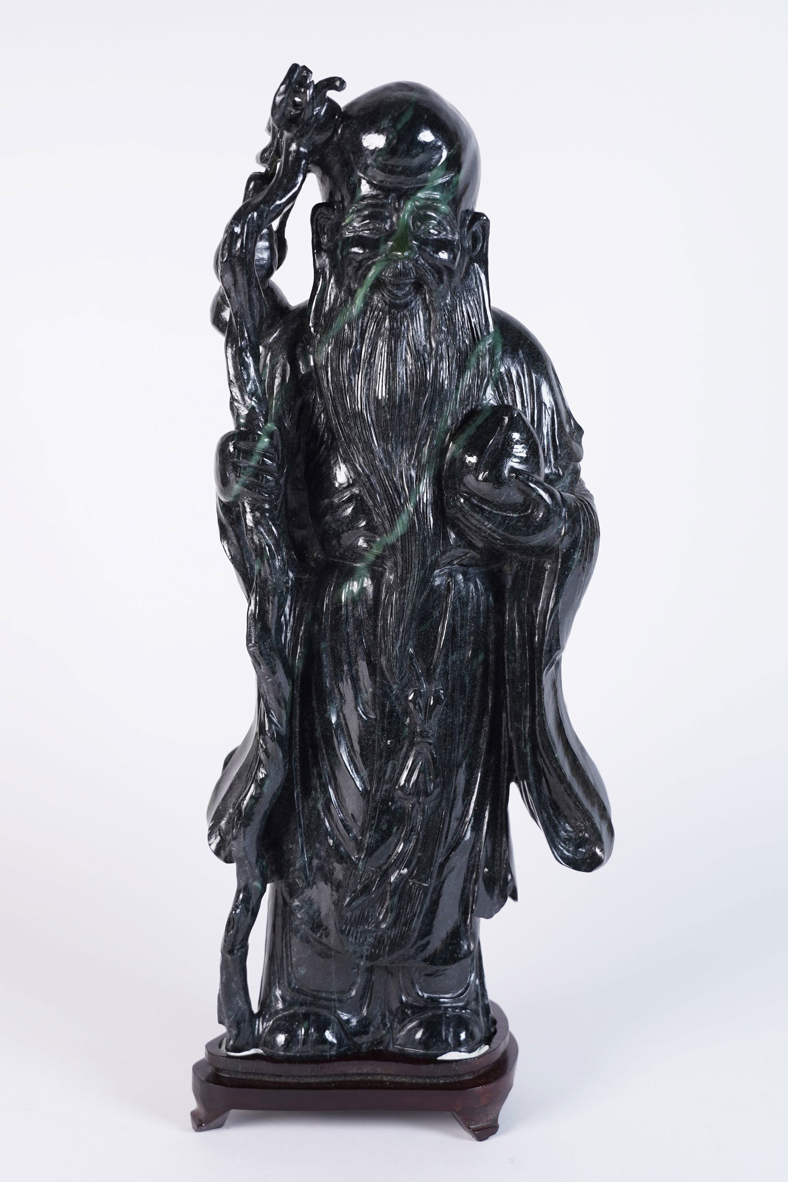 Chinese large jade deity: Chinese large jade carved deity. H: 14.5" x W: 6.5."