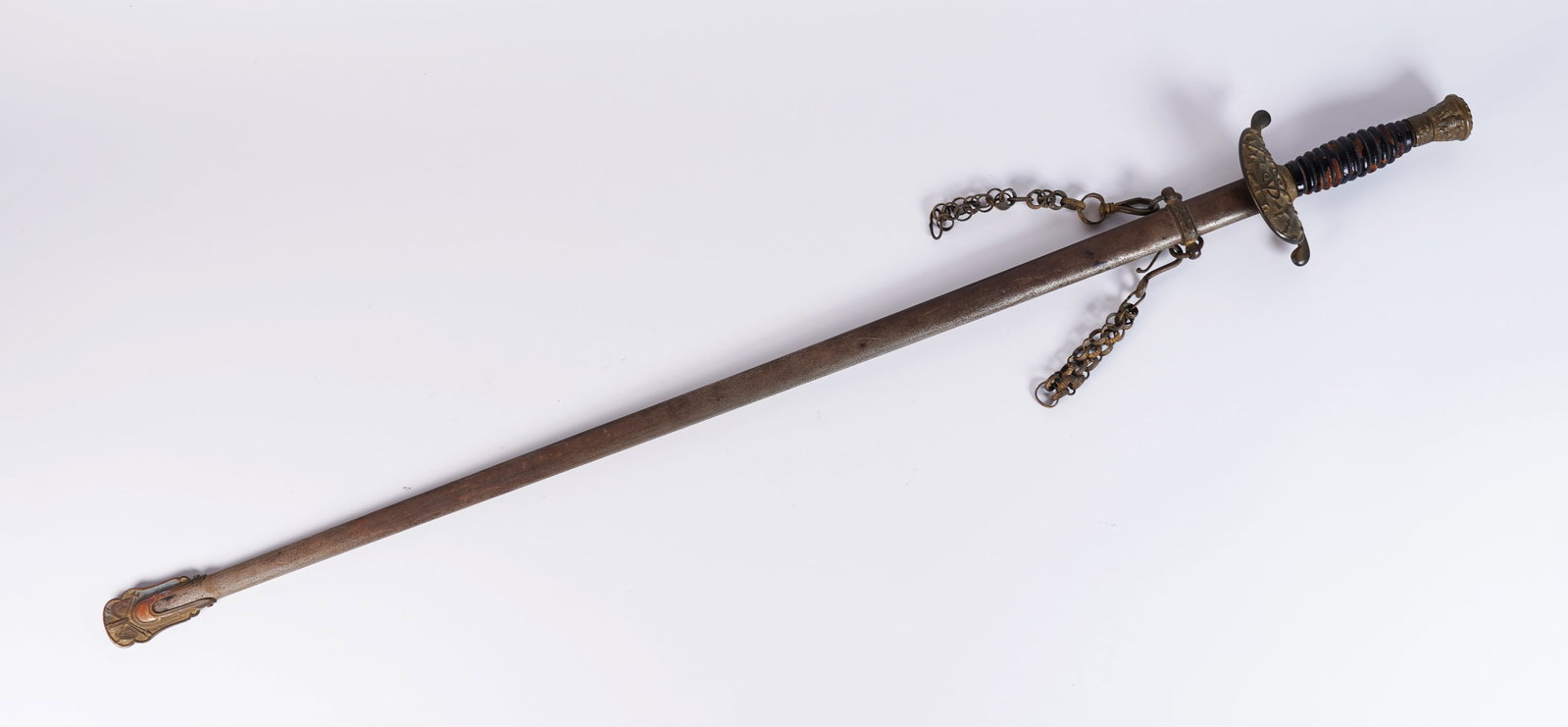 An antique long sword: An antique long sword. H: 4" x L: 35."