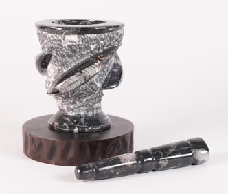 A stone carved grinder
