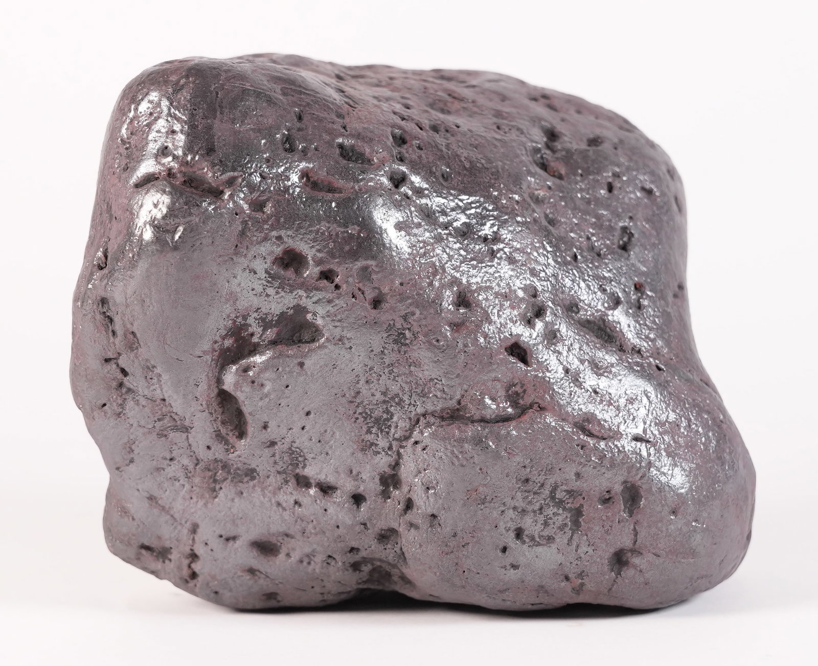A possible meteorite boulder: A possible meteorite boulder, heavy in weight. From an estate. Condition selling it as is. All sales are final. H: 4.3" x W: 6.3." Total weight, 13.2 lbs.