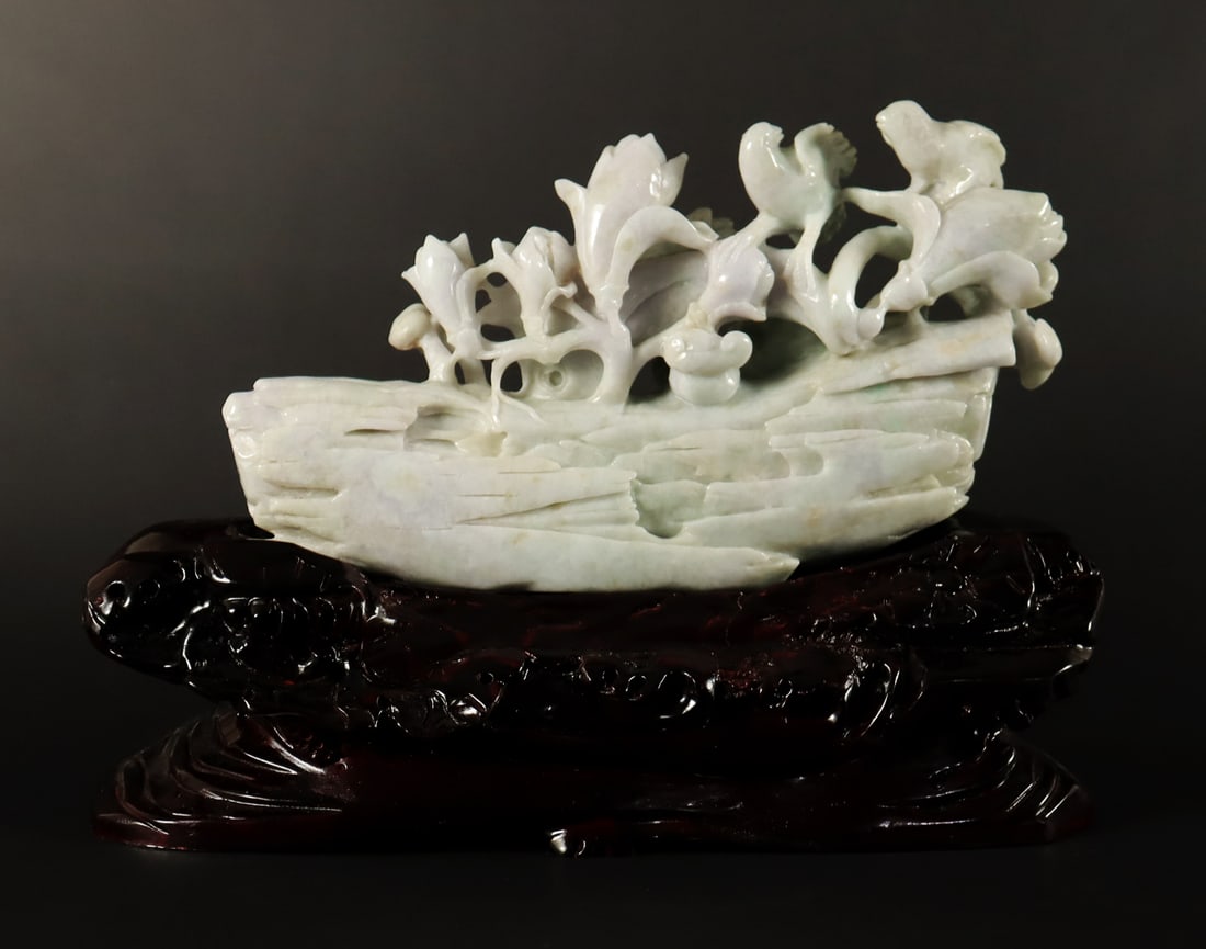 Chinese jadeite carving with stand: Chinese jadeite carving on stand. H: 6" x W: 10."