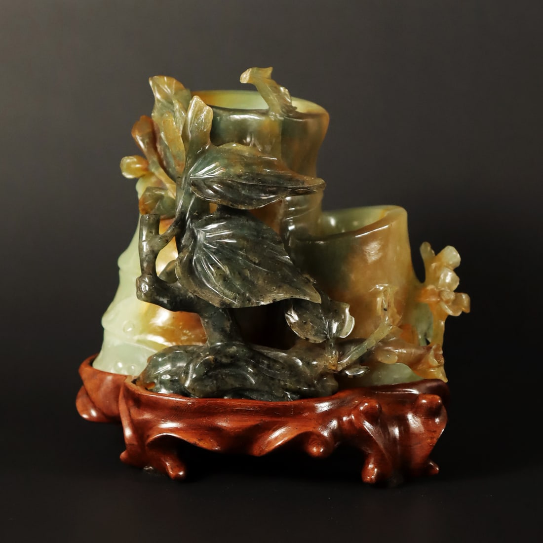 Chinese jade carving with stand: Chinese jade carving with stand. H: 5" x W: 5.5."