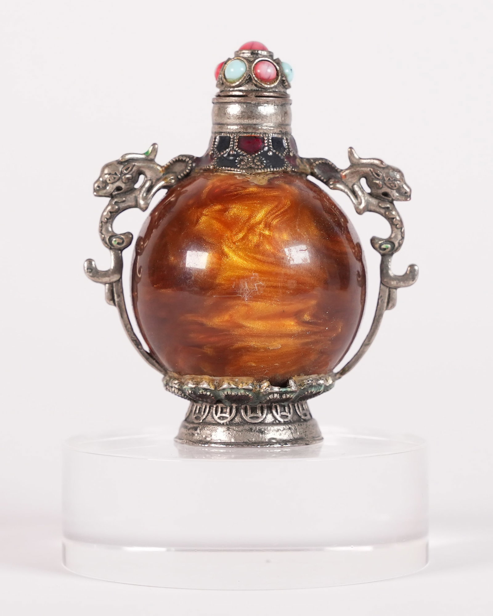 A fancy Tibetan snuff bottle: A fancy Tibetan snuff bottle. H: 3.3" x W: 2.9."