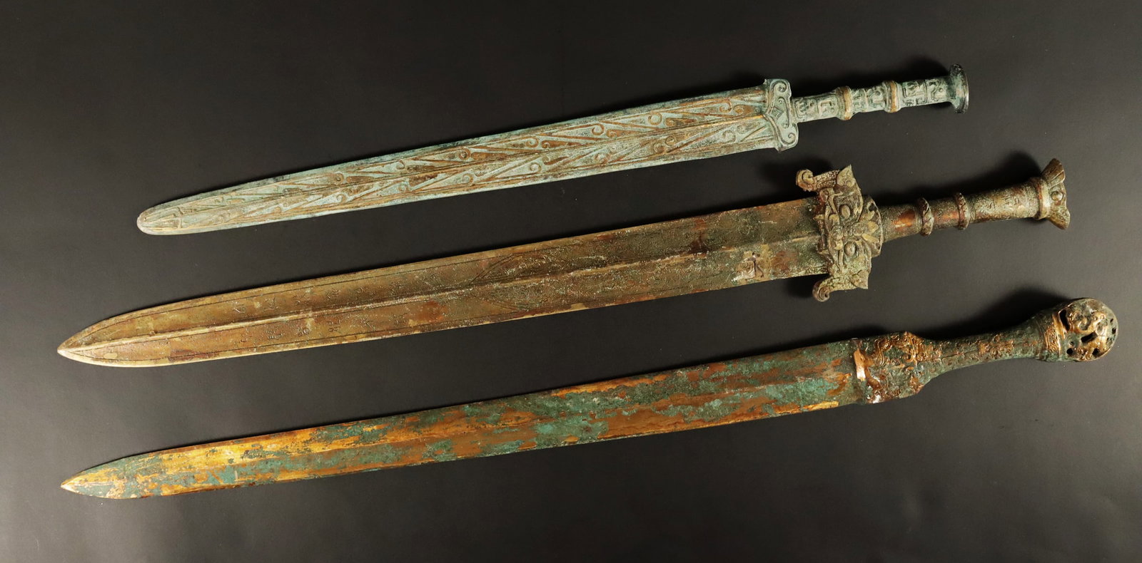 Lots Chinese bronze swords: Lots Chinese bronze swords. Longest L: 26.5" x H: 1.5."