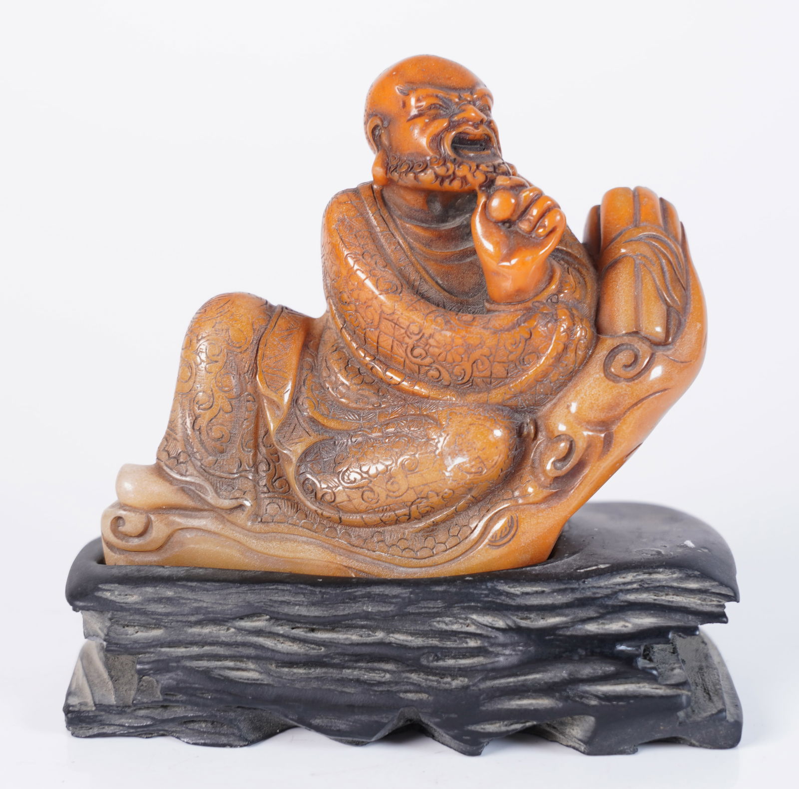 Chinese carved deity on stand: Chinese carved deity on stand. H: 5" x W: 4.75."