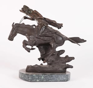 A Remington style bronze statue