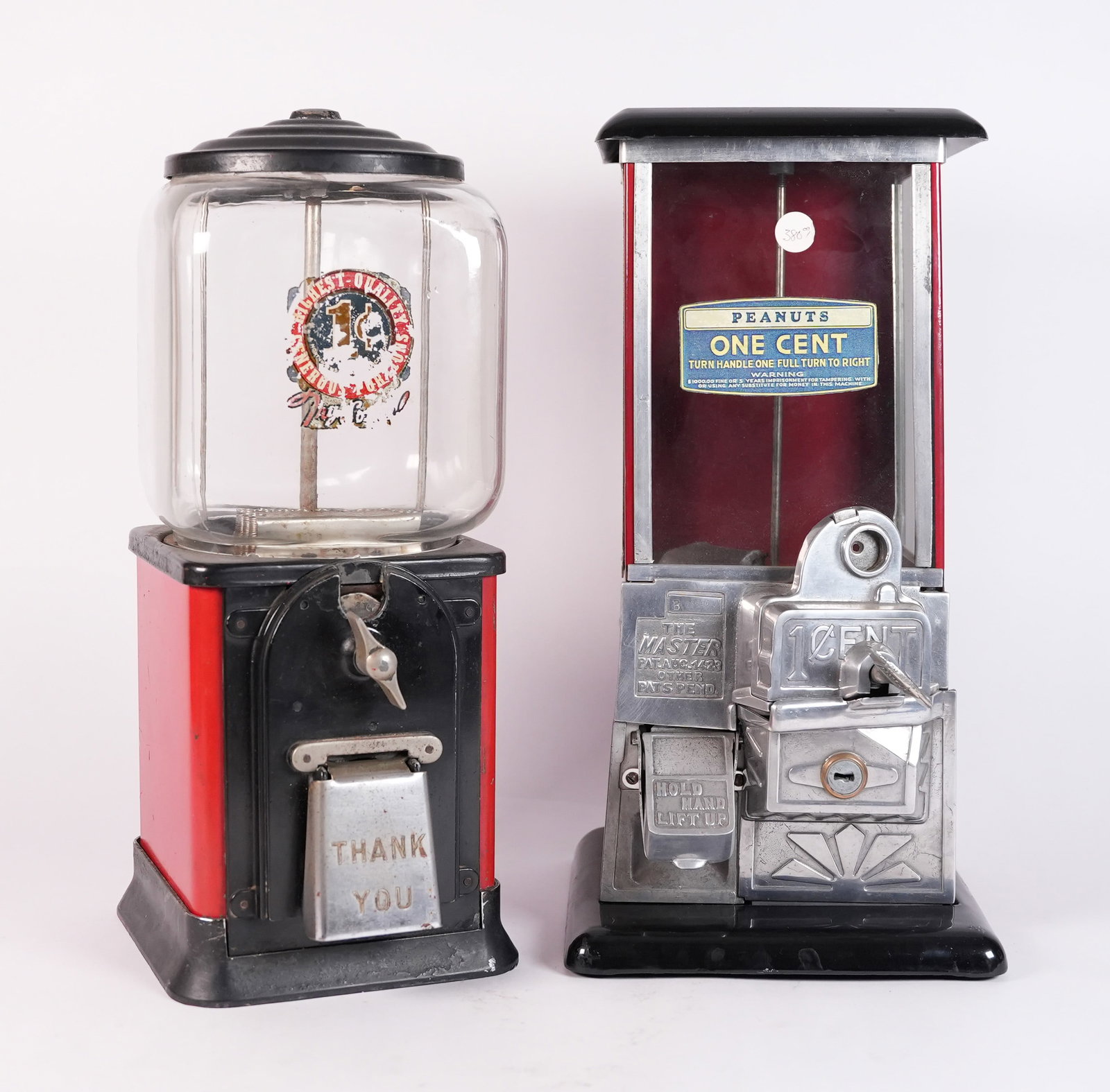 2 antique coin machines: 2 antique coin machines. Largest H: 16" x W: 8.5."