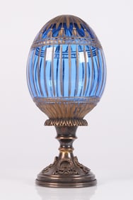 A signed Faberge egg with stand