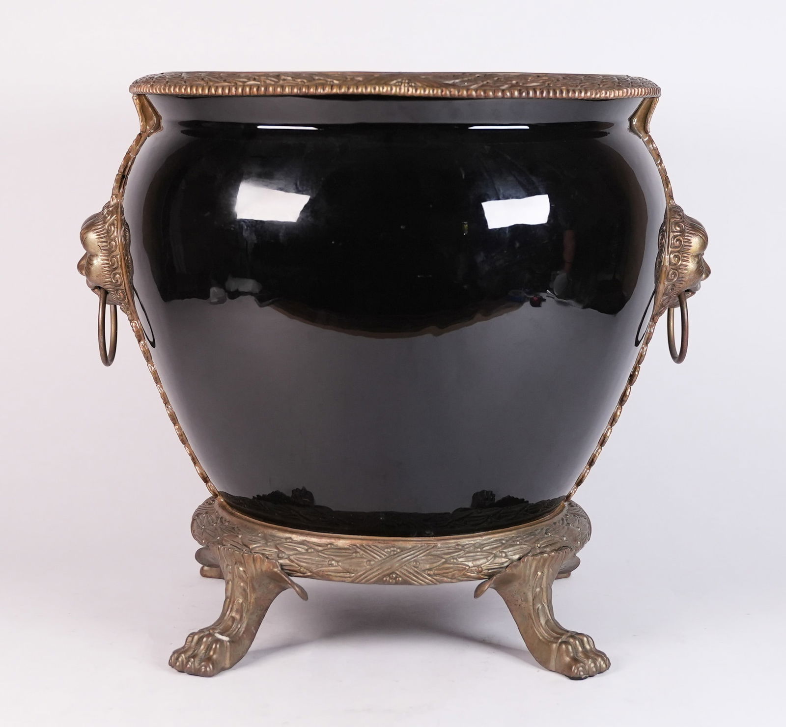 A large black jar: A large black jar. H: 13.5" x W: 13."