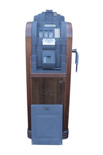 An antique heavy made slot machine: An antique heavy made slot machine, with back panel. H: 60" x W: