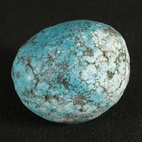 A large natural turquoise boulder