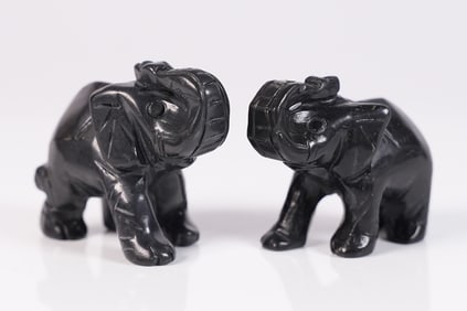 2 black tourmaline elephants