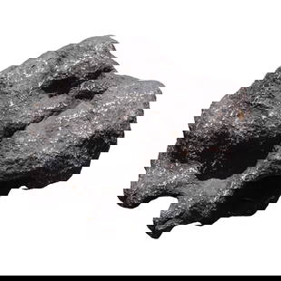 A possible meteorite boulder heavy: A possible meteorite boulder, heavy in weight. All sales are final, no return. H: 12" x W: 13."