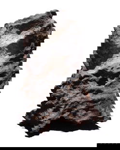 A possible meteorite boulder heavy: A possible meteorite boulder heavy in weight. All sales are final, no return. H: 14" x W: 10."