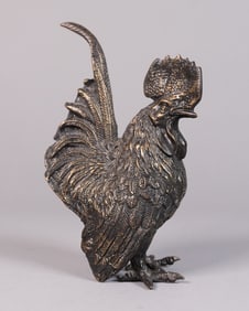 A metallic rooster statue
