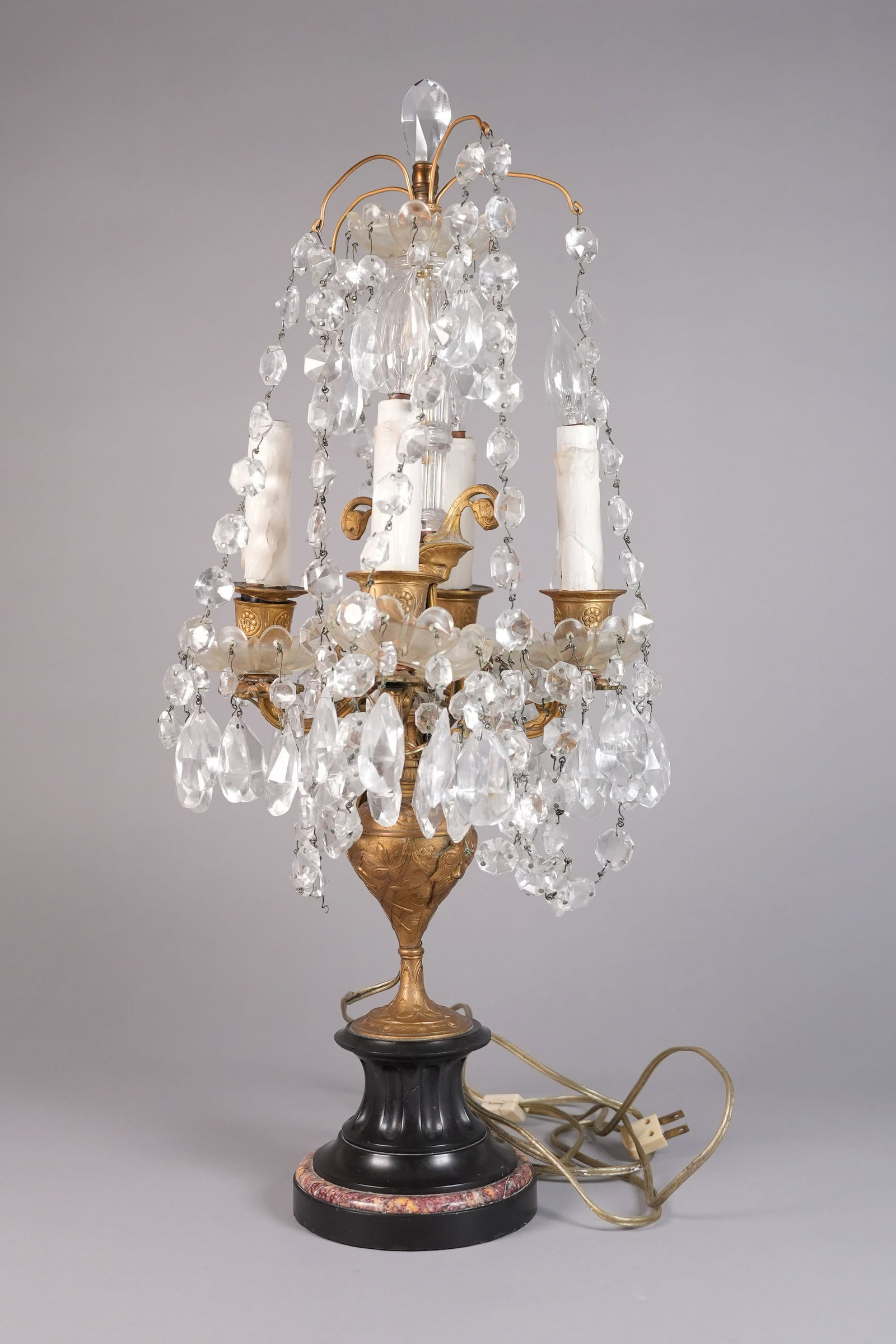 A vintage crystal brass lamp: A vintage crystal brass lamp. H: 26.5" x W: 5.6."