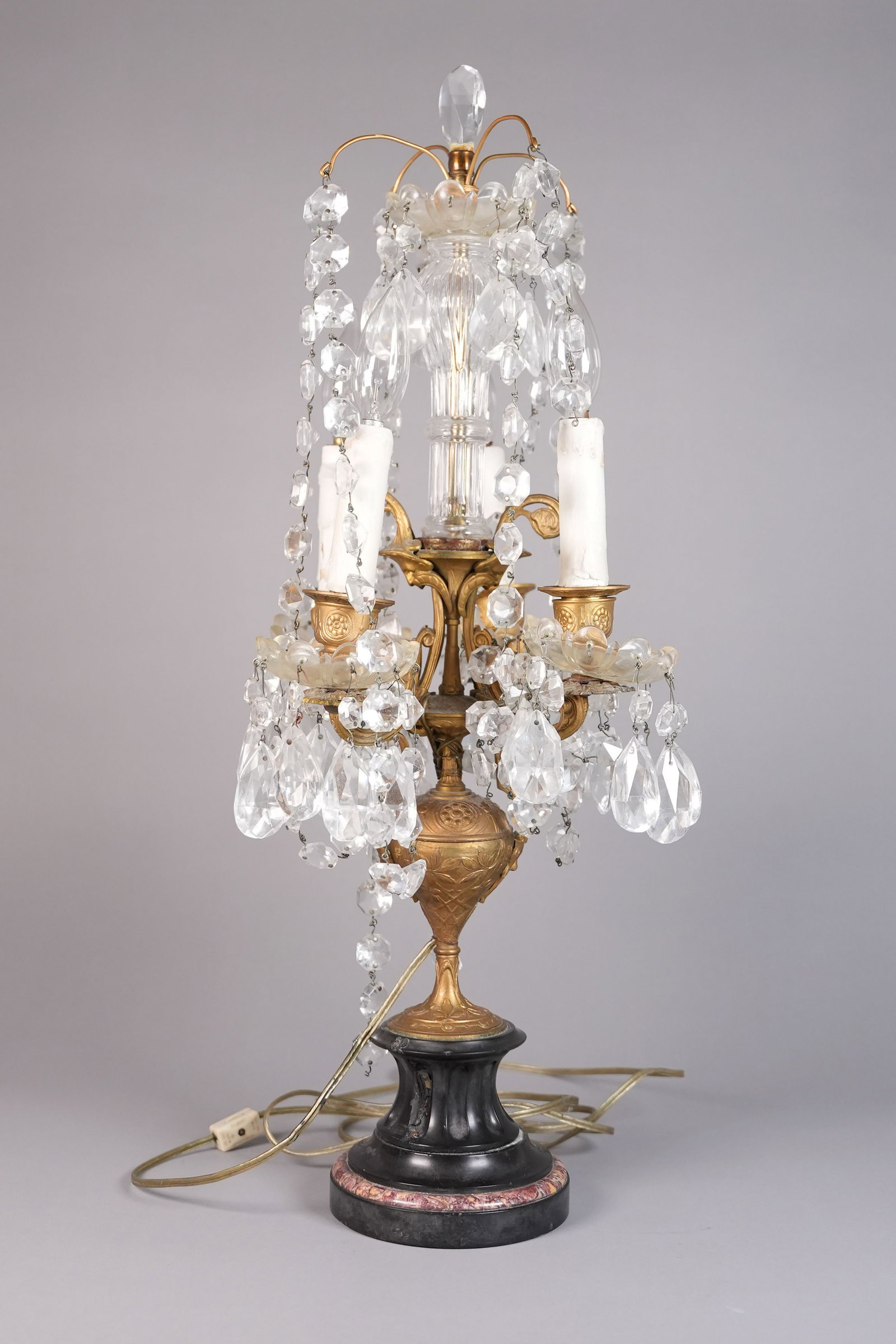 A vintage crystal brass lamp: A vintage crystal brass lamp. H: 27" x W: 5.5."