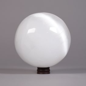 A large carved round ball