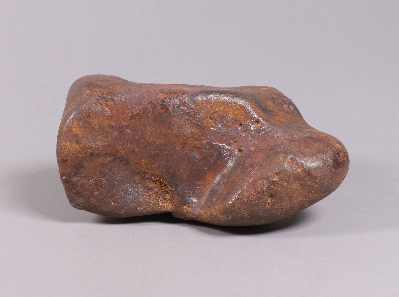 A heavy possible meteorite boulder: A heavy possible meteorite boulder, ungraded. All sales are final, no return. H: 3.6" x W: 6.3."