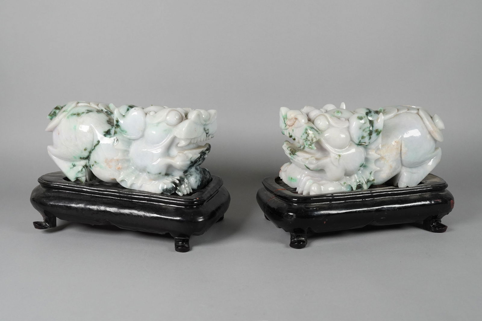 Lots Chinese jadeite beast: Lots Chinese jadeite beasts with wooden stand. H: 6.2" x W: 9.7."